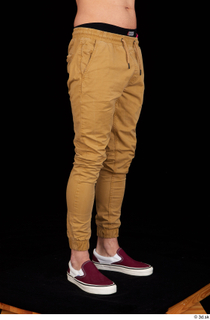 Pablo brown trousers dressed leg lower body red sneakers 0008.jpg